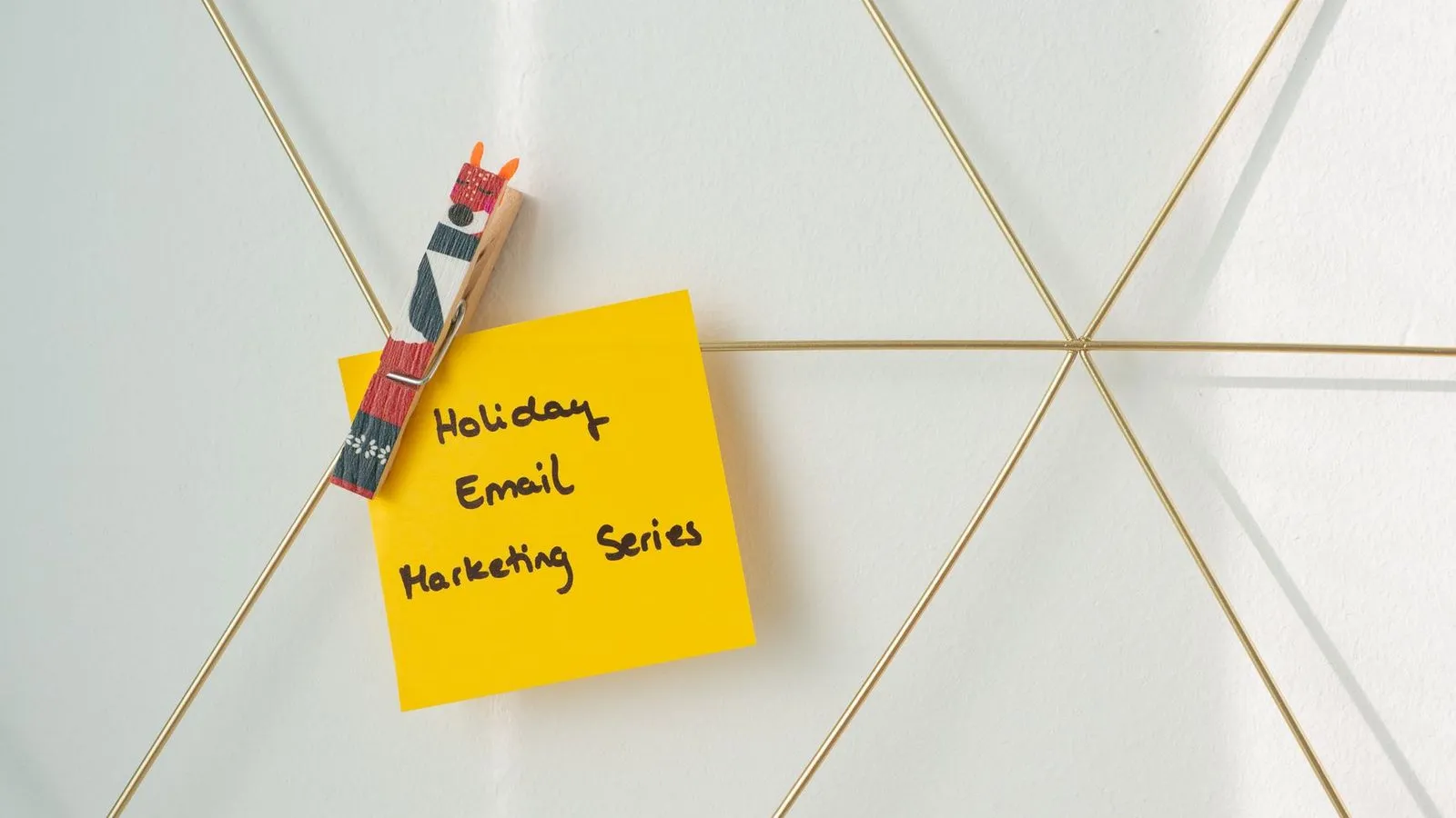 Email marketing campaign notes pinned to a website wireframe