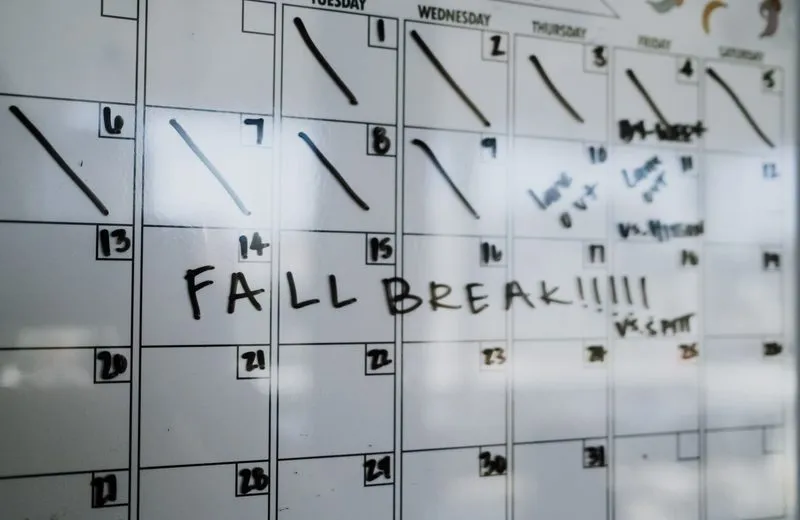 Whiteboard monthly calendar with “Fall Break” written across one week