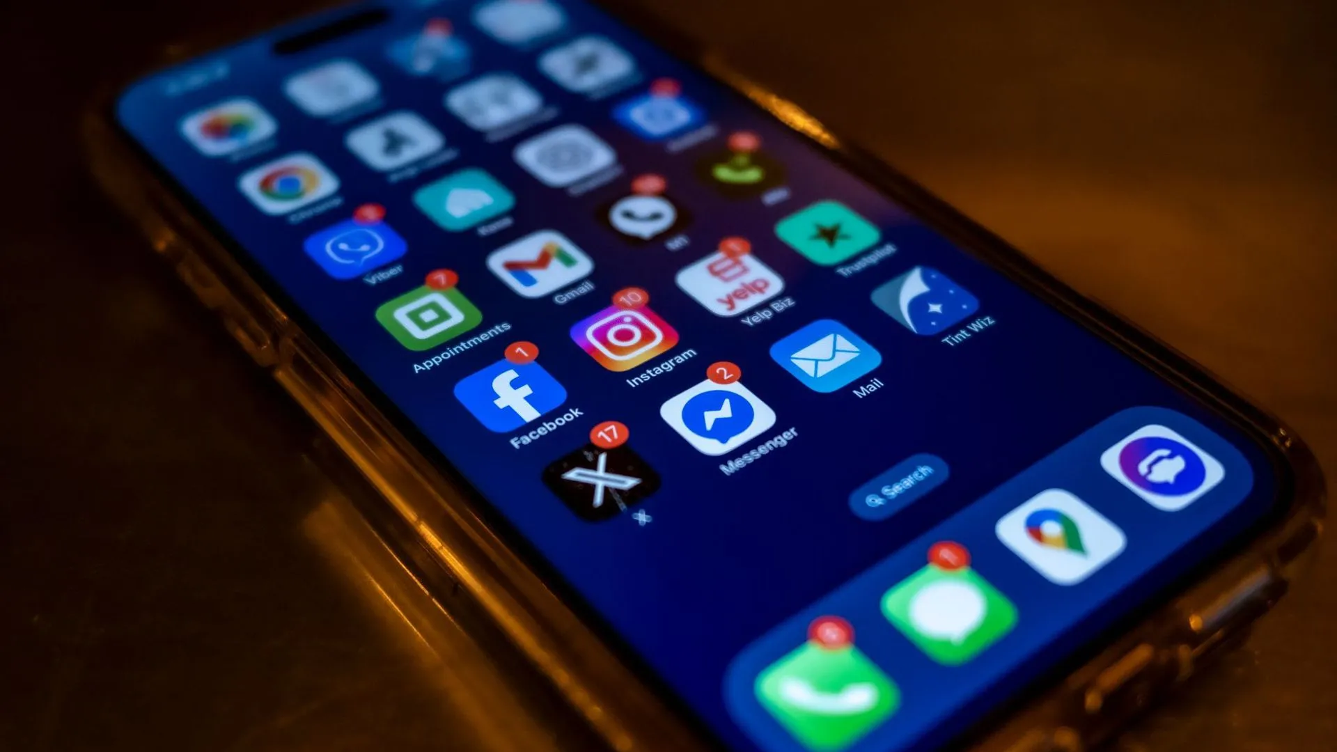 Smartphone home screen showing Facebook, Instagram and Messenger apps with new notification badges