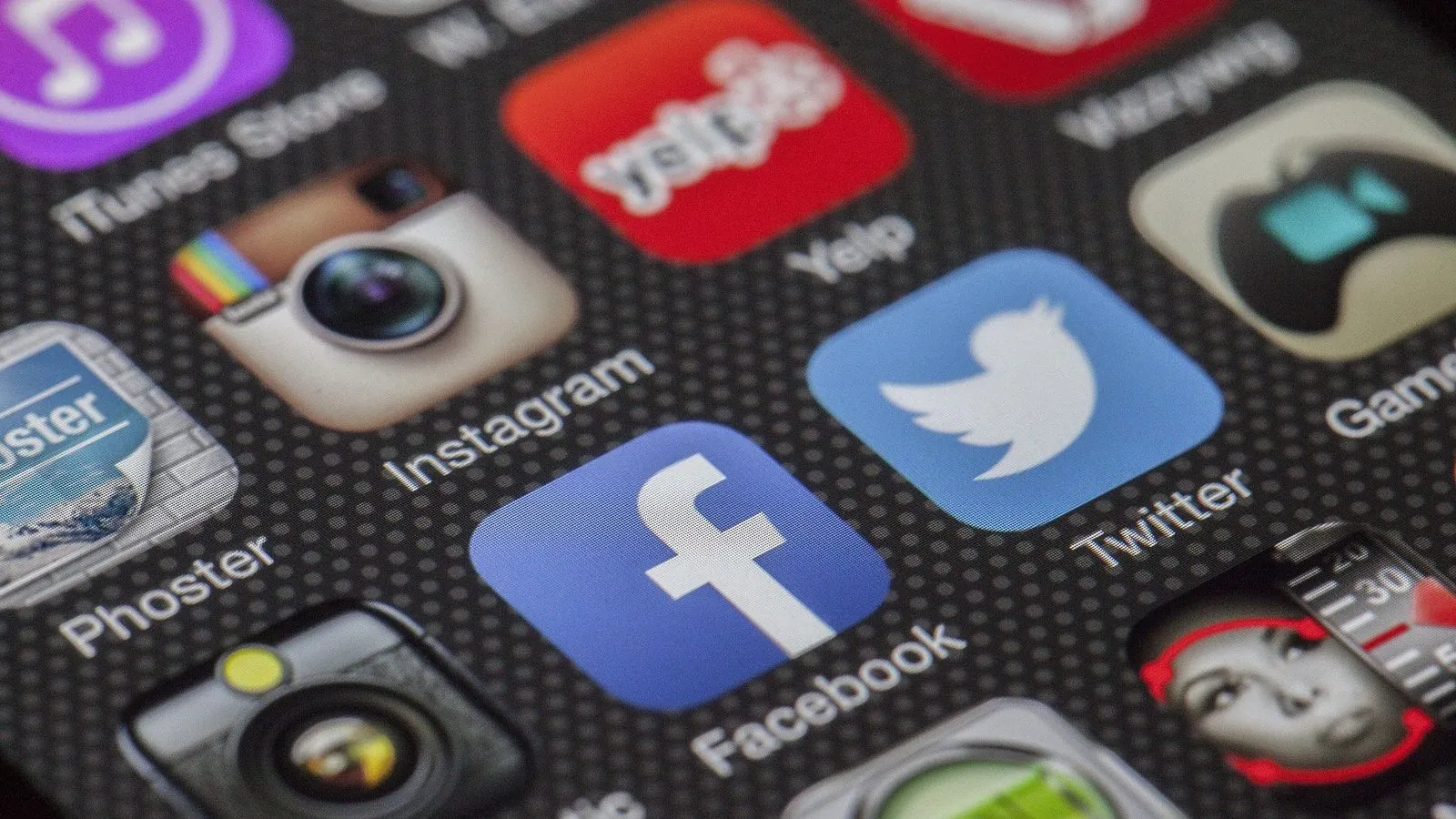 Social media app icons on a smartphone, representing social media marketing