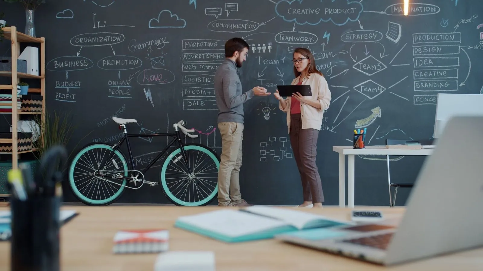 Two professionals brainstorming what to look for in a Redding, CA web design company