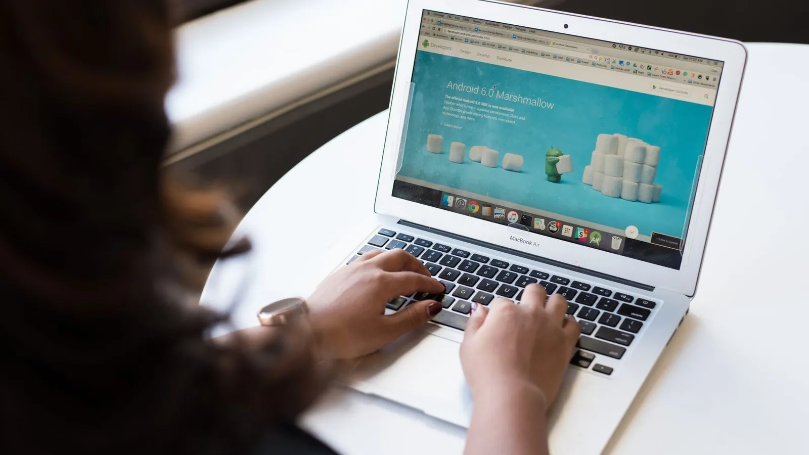 Business owner reviewing a completed WordPress website on her laptop